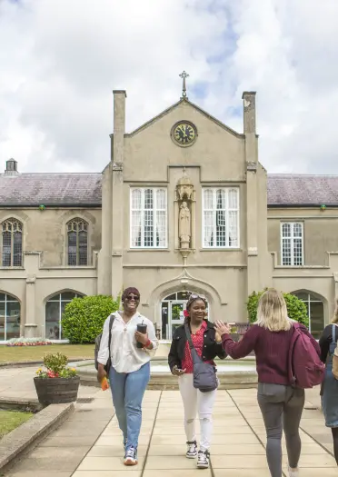 Students walking outside of their university campus