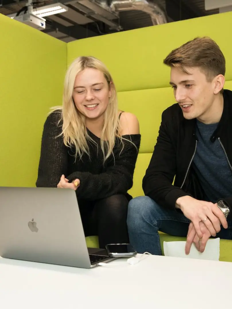 Students sharing work, between laptops