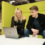 Students sharing work, between laptops